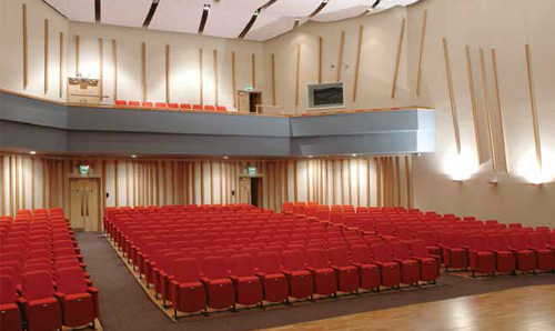 Red seats in the Cosmo Rodewald Concert Hall