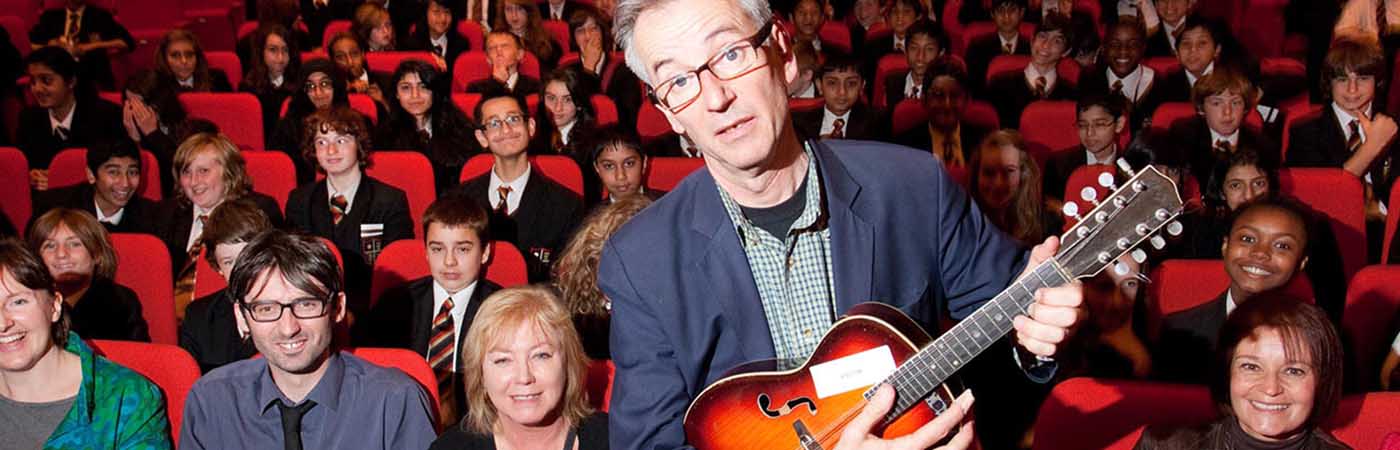 John Hegley in the Cosmo Rodewald Concert Hall with school groups