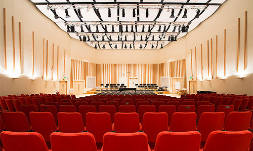 Red seats in the Cosmo Rodewald Concert Hall